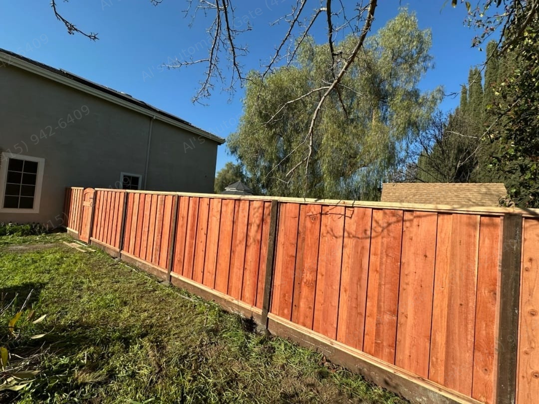 Redwood board-on-board fence installed by Al's Automatic Gate