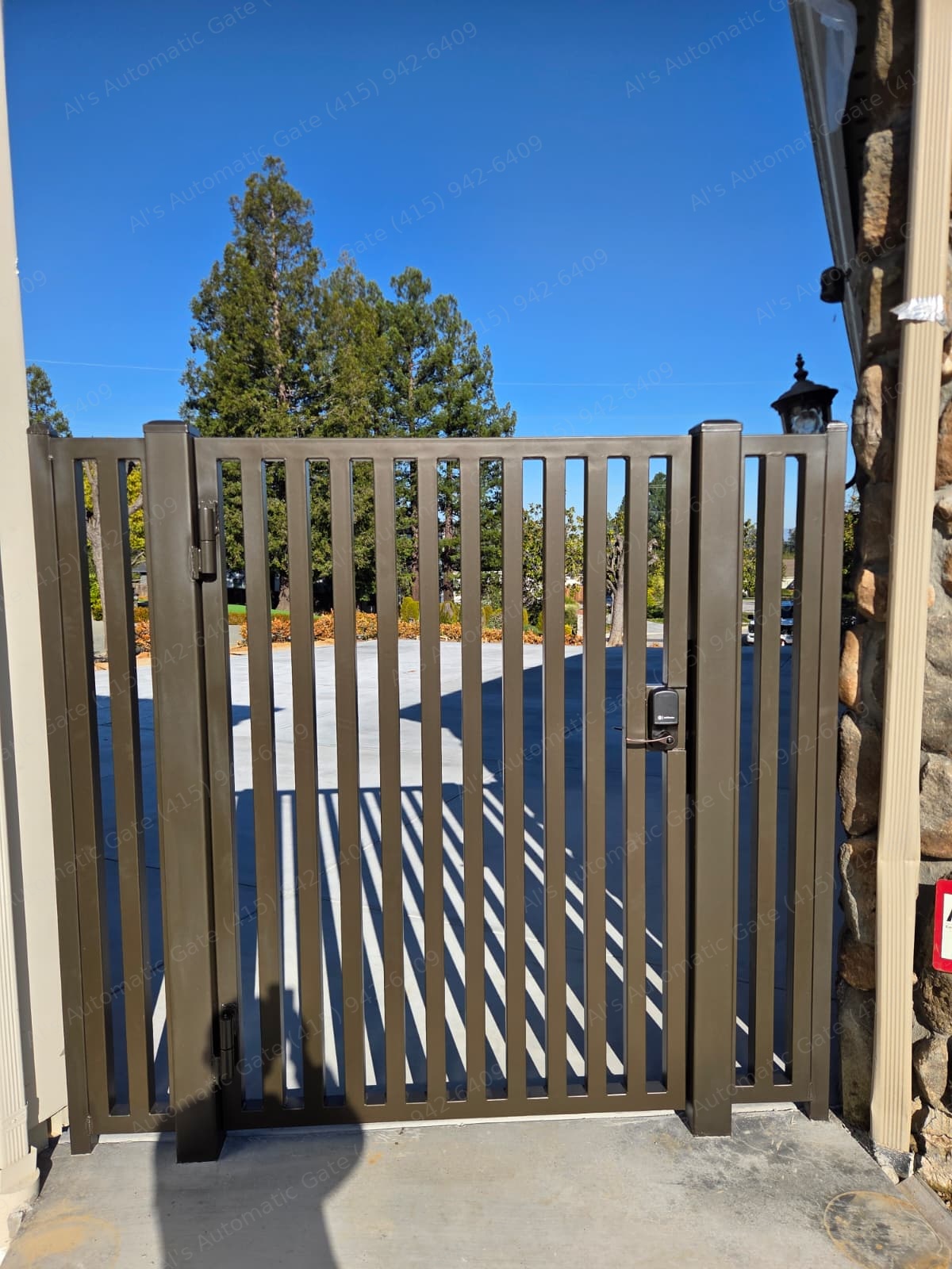 Bronze aluminum pedestrian gate with a smart keypad lock