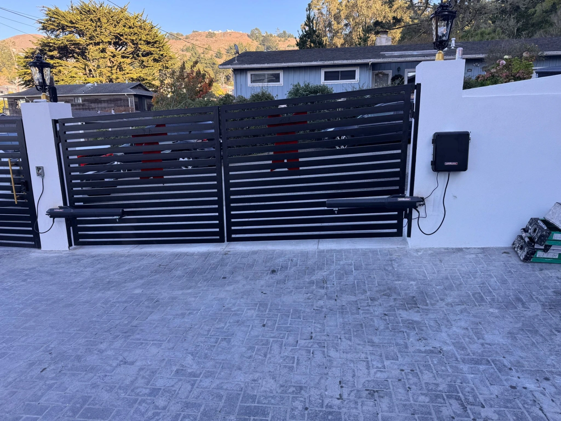 Dual swing driveway gate with LiftMaster arm operators installed by Al's Automatic Gate
