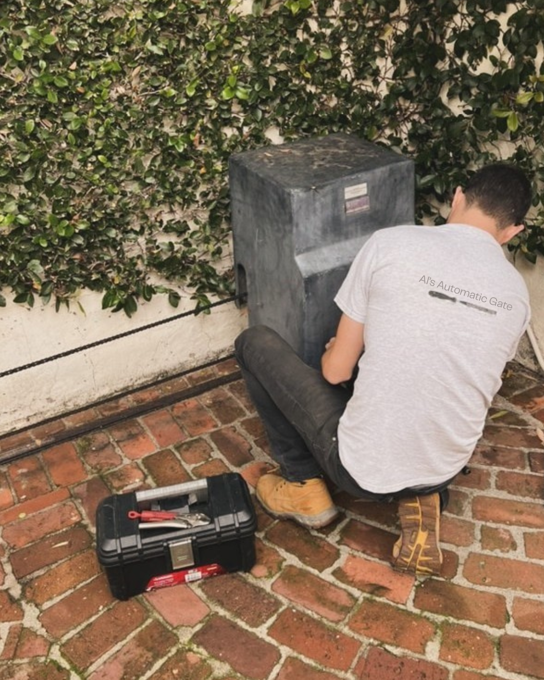 Al's Automatic Gate technician servicing a slide gate operator at a Marin County property